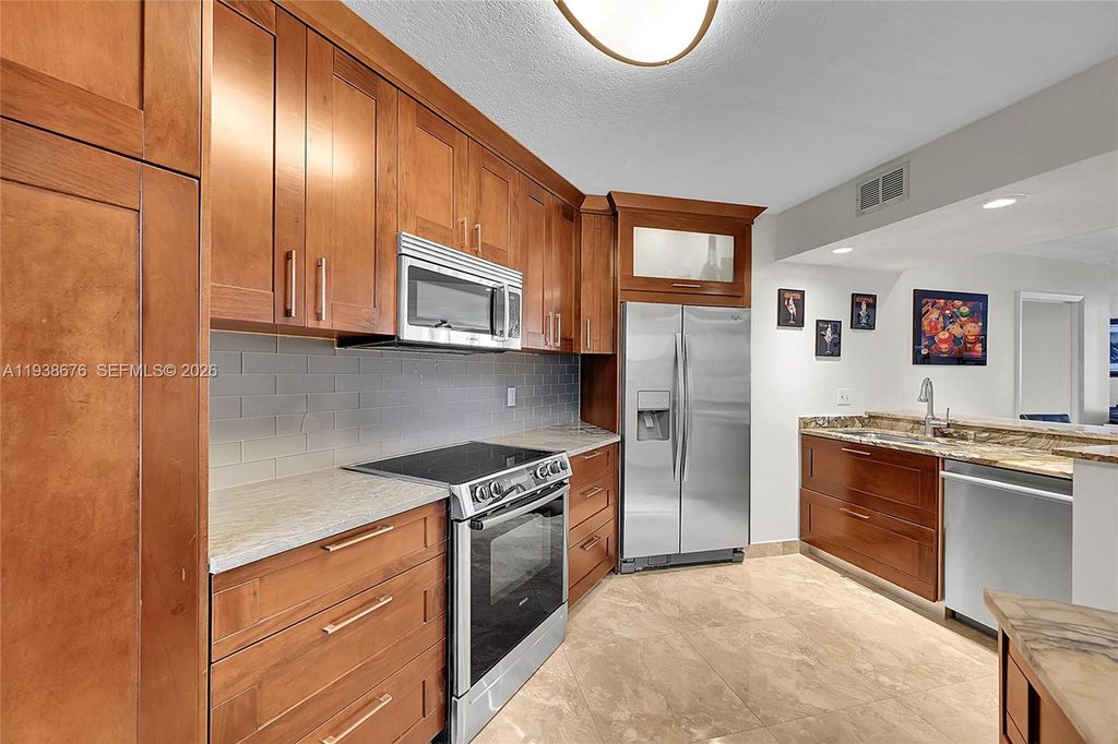 Photo of 10501 W Broward Blvd #311, Plantation, FL 33324 (MLS # A11938676)