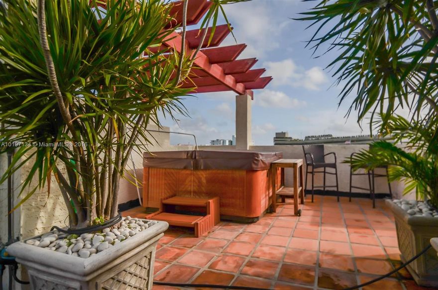 You will feel welcomed the second you enter this charming two-story town home. First level has an eat-in kitchen w/sliding doors to a balcony overlooking the courtyard. A bright living room & 2nd balcony, half bath & laundry room offer plenty of space. Upstairs features split-plan bedrooms w/balconies and 2 full baths. Master has access to a private rooftop with jacuzzi, shower & beautiful plants. Fully furnished w/covered parking, this unit is fully stocked with everything you need make it a true home.