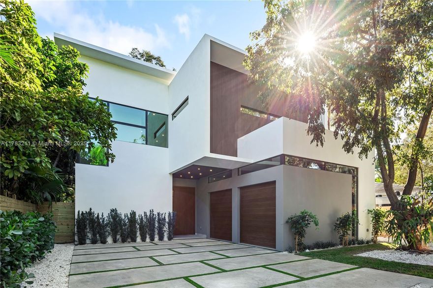 Elegantly done new construction located in the heart of the Grove, this stunning 5-bedroom, 5 1/2-bath home is a perfect blend of modern luxury and the neighborhood's timeless charm. Designed with elegance and comfort, the home features top-of-the-line finishes, a chef's kitchen with premium appliances, an elevator, and a summer kitchen perfect for entertaining. The serene backyard, shaded by a majestic oak tree, provides a tranquil oasis complete with a sparkling pool. A 2-car garage adds convenience to this thoughtfully crafted home. Surrounded by lush greenery, this home is just minutes from Miami's best restaurants, boutique shopping, and top-rated schools, offering a lifestyle that's both vibrant and family friendly.