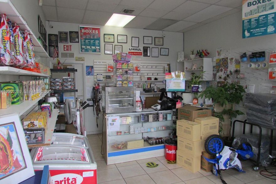Profitable Multi-Service Retail Store in Prime Miami Corridor. Turnkey opportunity to acquire a highly diversified, income-producing retail business with over 10 years of continuous operation in one of Miami’s most active commercial areas. Ideally situated on Calle Ocho, this location benefits from strong visibility, dense population, and consistent customer traffic. 1,300 sq. ft. retail space offering: National and international cargo/shipping services. Worldwide money transfers, PO Box rentals, Lottery (Lotto) sales, U-Haul truck rentals and moving supplies (cartons, packing materials, etc.), Retail sales of Colombian food products.
The sale includes a well-established business phone number. The premises are equipped with an alarm system for security. 10-year lease in place. Rent includes water, sewer, and pest control. Parking in both the front and rear. Strategically located just two blocks from Le Jeune Road and approximately 2 miles from Miami International Airport and Coral Gables. Approximate Net Operating Income (NOI): $78,000 annually. This business may also present an opportunity for buyers seeking qualification under U.S. immigration investment programs (subject to independent legal and immigration review). Ideal for an owner-operator or investor seeking a stable, multi-income business with strong fundamentals and growth potential in a prime Miami location. Owner moving to other state but can stay for two weeks and train new owner.