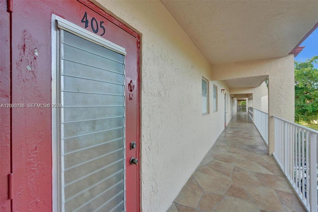 Photo of 1030 Country Club Dr #405, Margate, FL 33063 (MLS # A12023785)