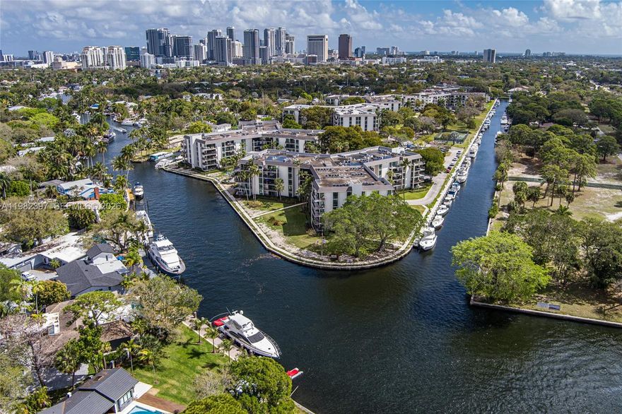 Explore a beautifully renovated first-floor condo with garage parking and a lovely partial river view! Located near the FLL airport, Las Olas, downtown, and the beach, this prime location offers unmatched convenience. Enjoy watching the Jungle Queen and yachts glide by every day. What a delightful experience! Or perhaps you’d like to take your own boat out. Boat packages are available at $40/foot per year for vessels up to 50' OAL, when available—no fixed bridges to the ocean. Amenities include 24/7 security, 3 heated pools, 2 tennis courts, and 2 pickleball courts. There is also kayak storage and BBQ areas. A boat dock surrounds the island, available for boat dockage as well as exercise 24 hrs. a day. The community boasts a well-funded reserve, newly installed high-impact windows, new balconies and railings, a contemporary new paint color, and new landscaping and lighting.