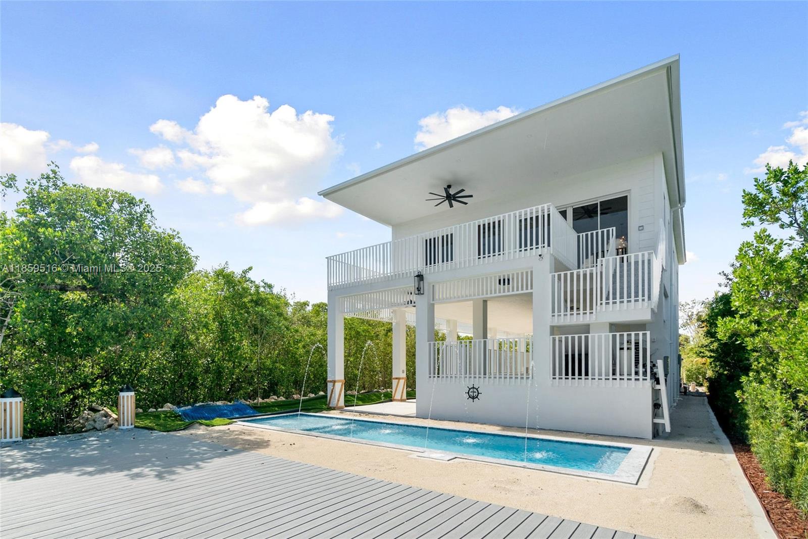 Experience Elevated Coastal Living - Brand New Oceanside Pool Home with Dock in Key Largo Welcome to your dream waterfront retreat in Key Largo! This stunning brand-new, 4 bedroom and 4 bath custom-built pool home combines sleek modern design with top-tier amenities, offering the perfect blend of style and comfort. Let's start with your Outdoor Paradise. Step outside to your private heated and chilled saltwater pool with a 5'-6'' depth, massage jets, beach shelf with umbrella holder, five LED lights, and a safety net for peace of mind. The expansive 15' x 40' dock features polyurethane synthetic decking, a power pedestal with LED lighting, water hookup, 30-amp and 120V receptacles—ideal for boating enthusiasts.