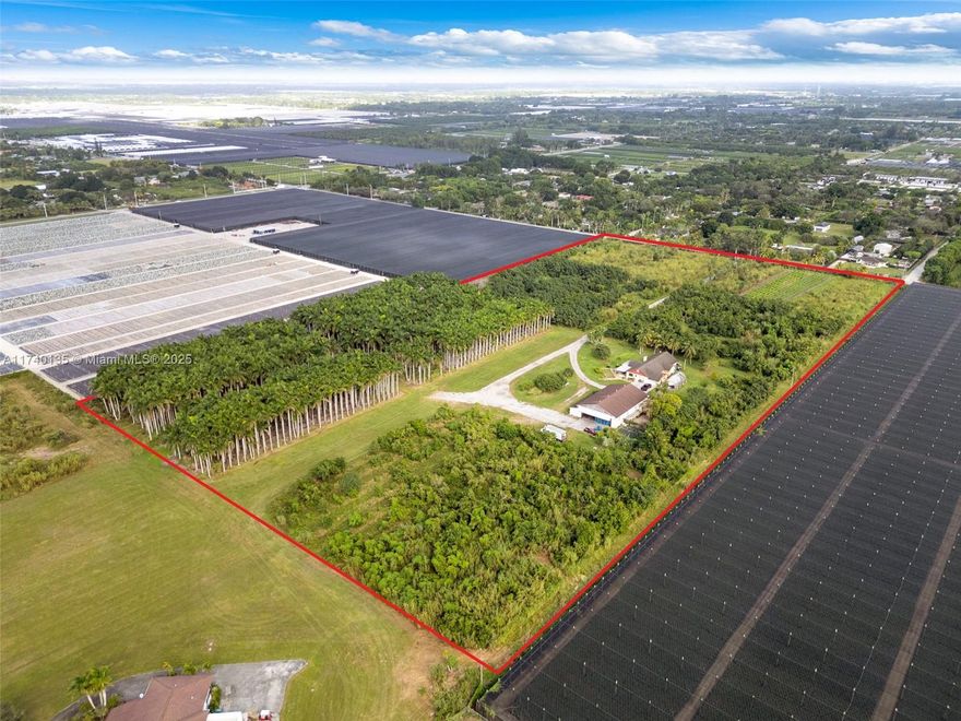 Almost 20 acre Agricultural Compound in South Miami-Dade featuring a 4800 sq. ft. hanger w/ new walk in cooler, sitting adjacent to Richards Air Field a private 2,000 ft run-way. The property also has a 4/2.5 House, A 1/1 apartment in hanger, assorted fruit & palm tree grove. The property is agriculturally exempt perfect for an agri-tourism business. There are multiple entrances, fully fenced, with driveway & access to landing strip. Situated in the heart of Redland, this is a one of a kind opportunity.