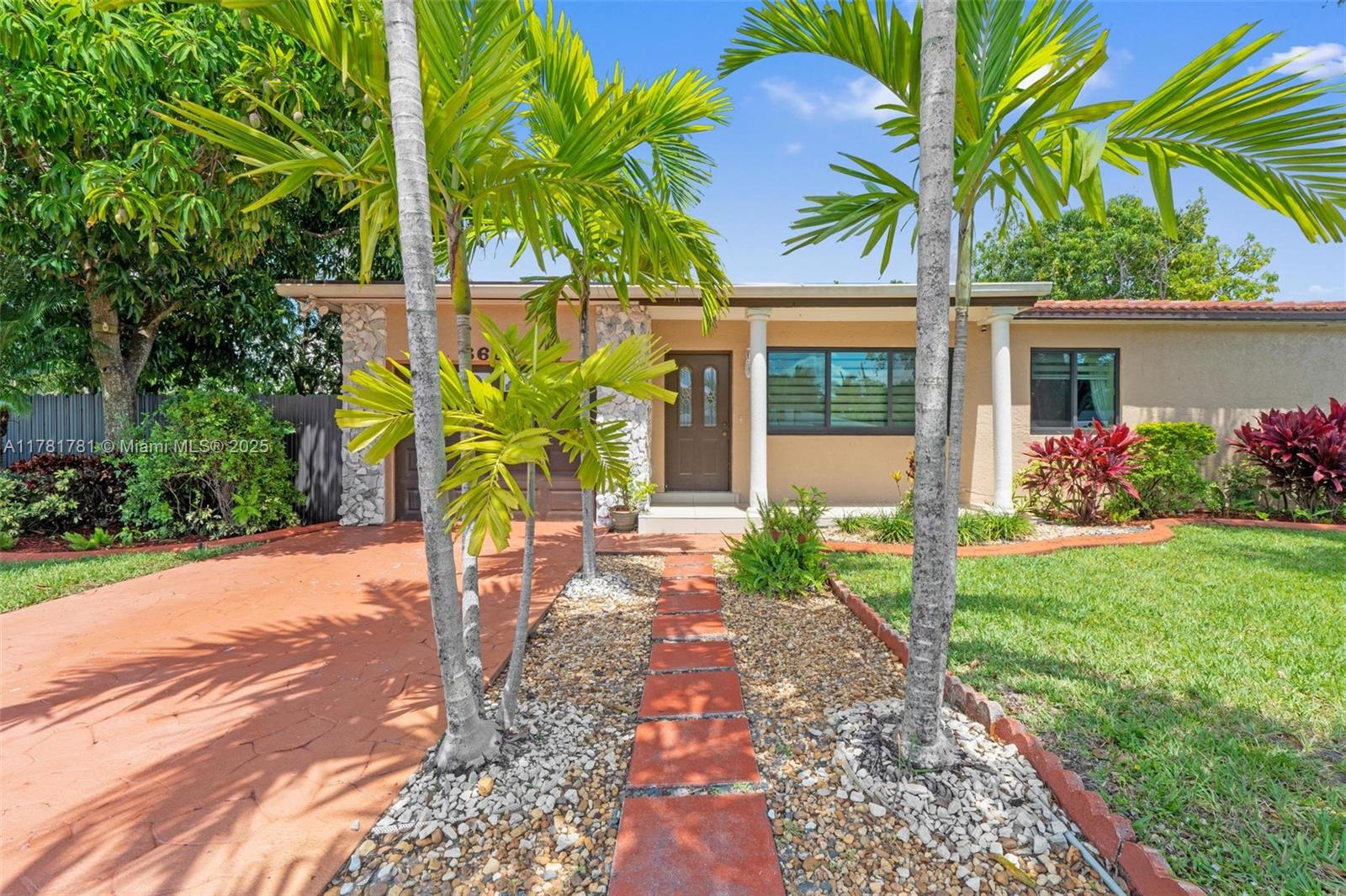 Charming single-story home located on a corner lot, home perfect for family living! Enjoy a spacious backyard with fruit trees including mango, avocado, and more. Relax in the screened-in covered porch, ideal for Florida’s outdoor lifestyle. The home features a remodeled kitchen, spacious living and dining areas, 3 bedrooms, 2 full bathrooms, tile roof, impact windows, 1-car garage, and a driveway that fits two additional vehicles. Located in a peaceful and quiet neighborhood with NO HOA. A wonderful opportunity to enjoy comfort, space, and privacy!
