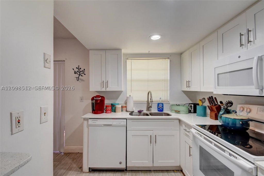 Photo of 7831 NW 44th Ct #7833, Coral Springs, FL 33065 (MLS # A12098512)