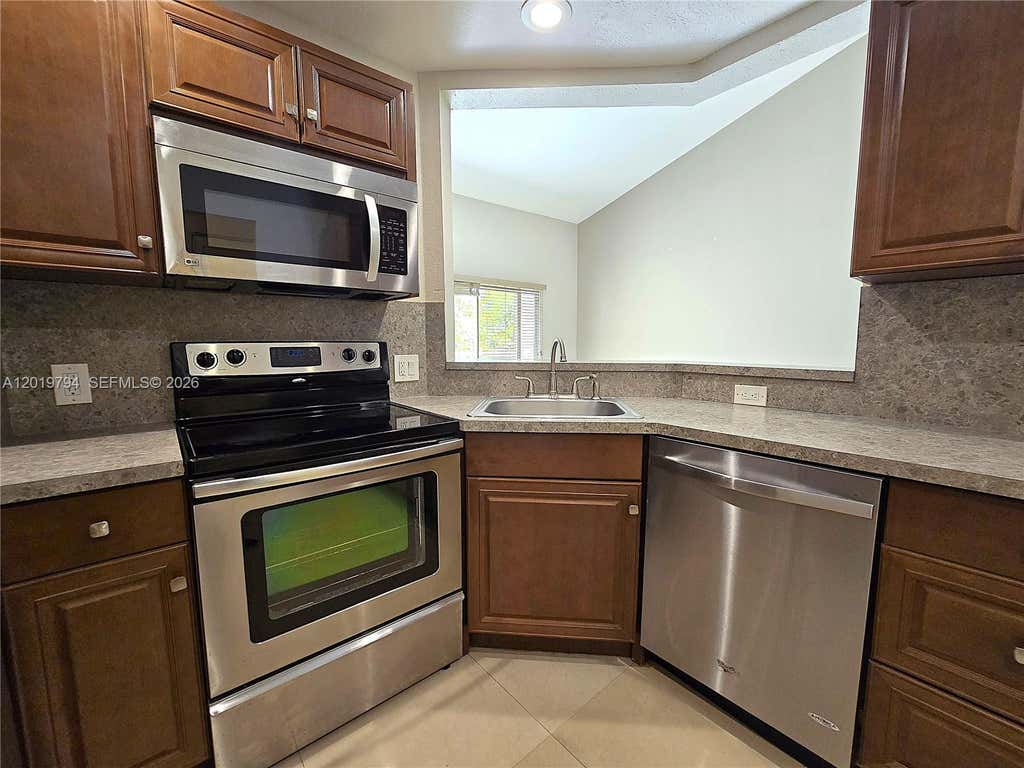 Photo of 3457 NW 44th St #205, Oakland Park, FL 33309 (MLS # A12019794)
