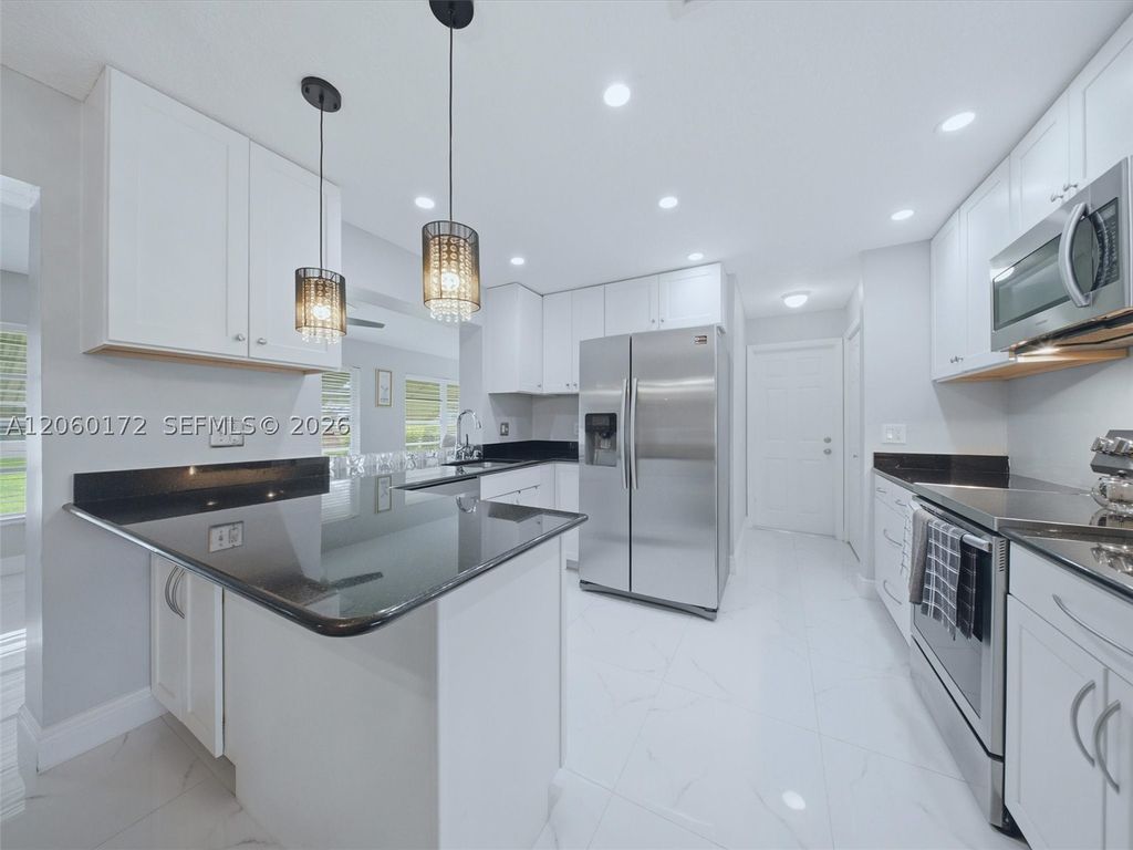 Photo of 1221 NW 45th St, Deerfield Beach, FL 33064 (MLS # A12060172)