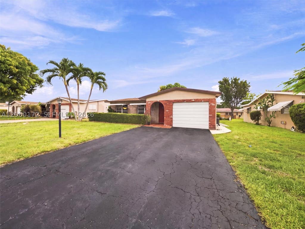 Photo of 1221 NW 45th St, Deerfield Beach, FL 33064 (MLS # A12060172)