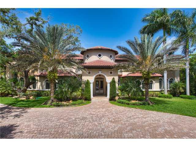 Striking Mediterranean estate sited on an acre artfully displays exquisite finishes and craftsmanship with generously scaled rooms and volume ceilings, showcasing gleaming marble and hardwood floors and exquisite millwork. On the second level you find a s umptuous master suite with a sitting room, a second family room and four additional bedrooms all with en suite baths.  A sprawling terrace, gazebo with summer kitchen and sparkling swimming pool complete this grand estate. Walled and gated for privacy.