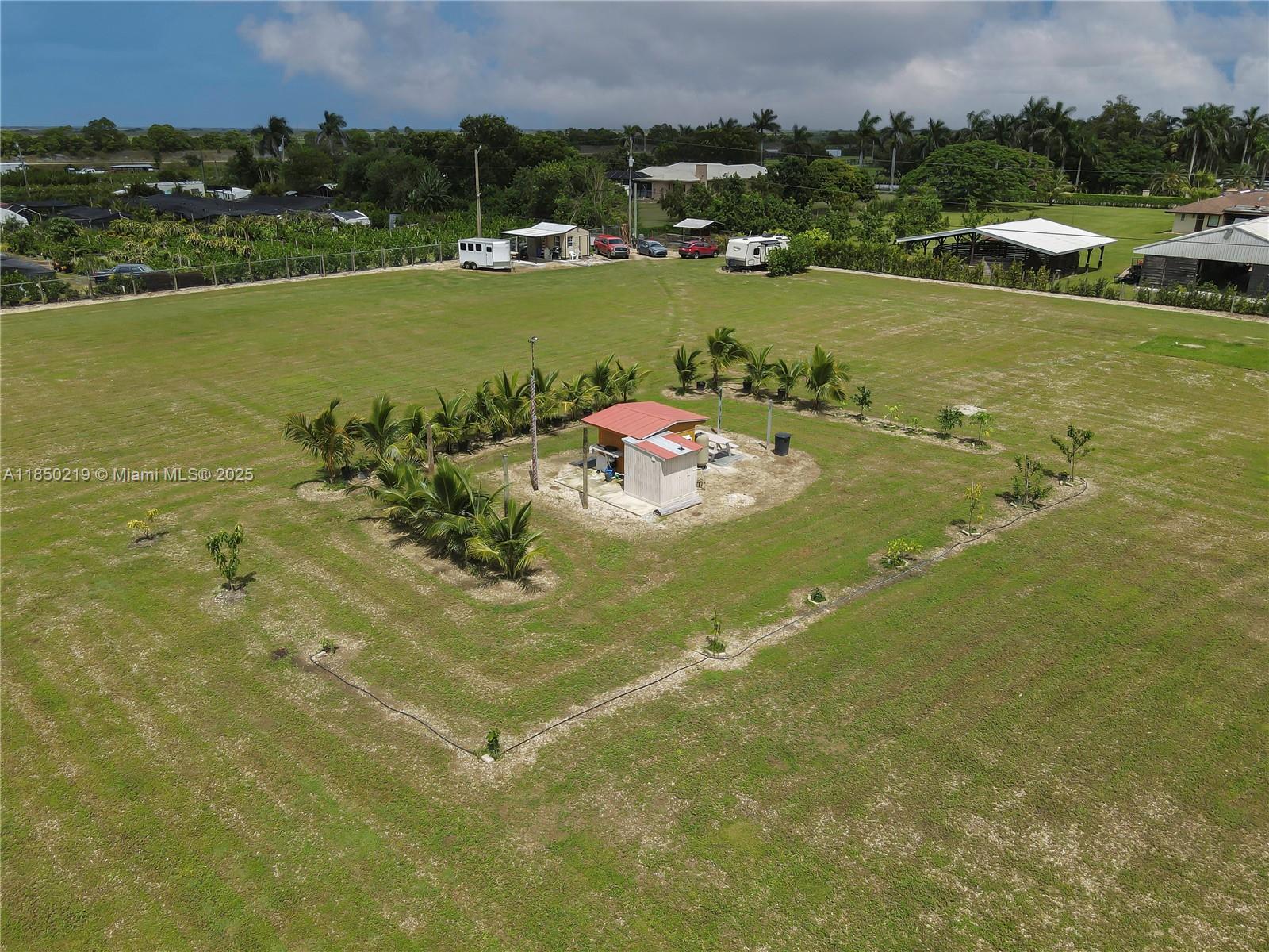 Zoning Use: RESIDENTIAL, AGRICULTURE or BOTH in the heart of Homestead, Florida! FINANCING OPTIONS!! - 2.5 pristine acres of land, ready to fulfill your vision. With a coveted buildable site letter from Miami-Dade County, this is your canvas to create the RANCH and/or FARM you've always imagined. This idyllic property boasts two wells, ensuring an abundant water supply for your agricultural endeavors. A pump and electricity are already in place, saving you time and effort as you embark on this exciting venture. Whether you envision a tranquil escape from city life or a thriving agricultural operation, this Homestead gem offers endless possibilities. Don't miss out on this rare chance to turn your dreams into reality; secure your piece of paradise today!