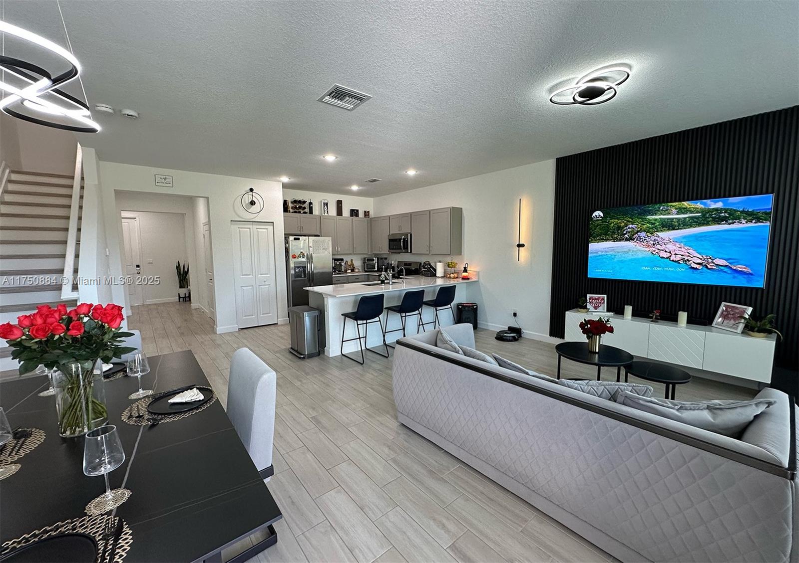Located in a gated community, this newly built, two-story townhome offers a spacious and functional layout perfect for family living. The open-concept first floor features a modern kitchen, dining area, and Great Room, with easy access to a covered patio—ideal for outdoor relaxation. Upstairs, you'll find all four bedrooms, including the owner’s suite with a private bathroom and walk-in closet. A garage provides extra storage, and residents can enjoy community amenities like a pool and recreational facilities.