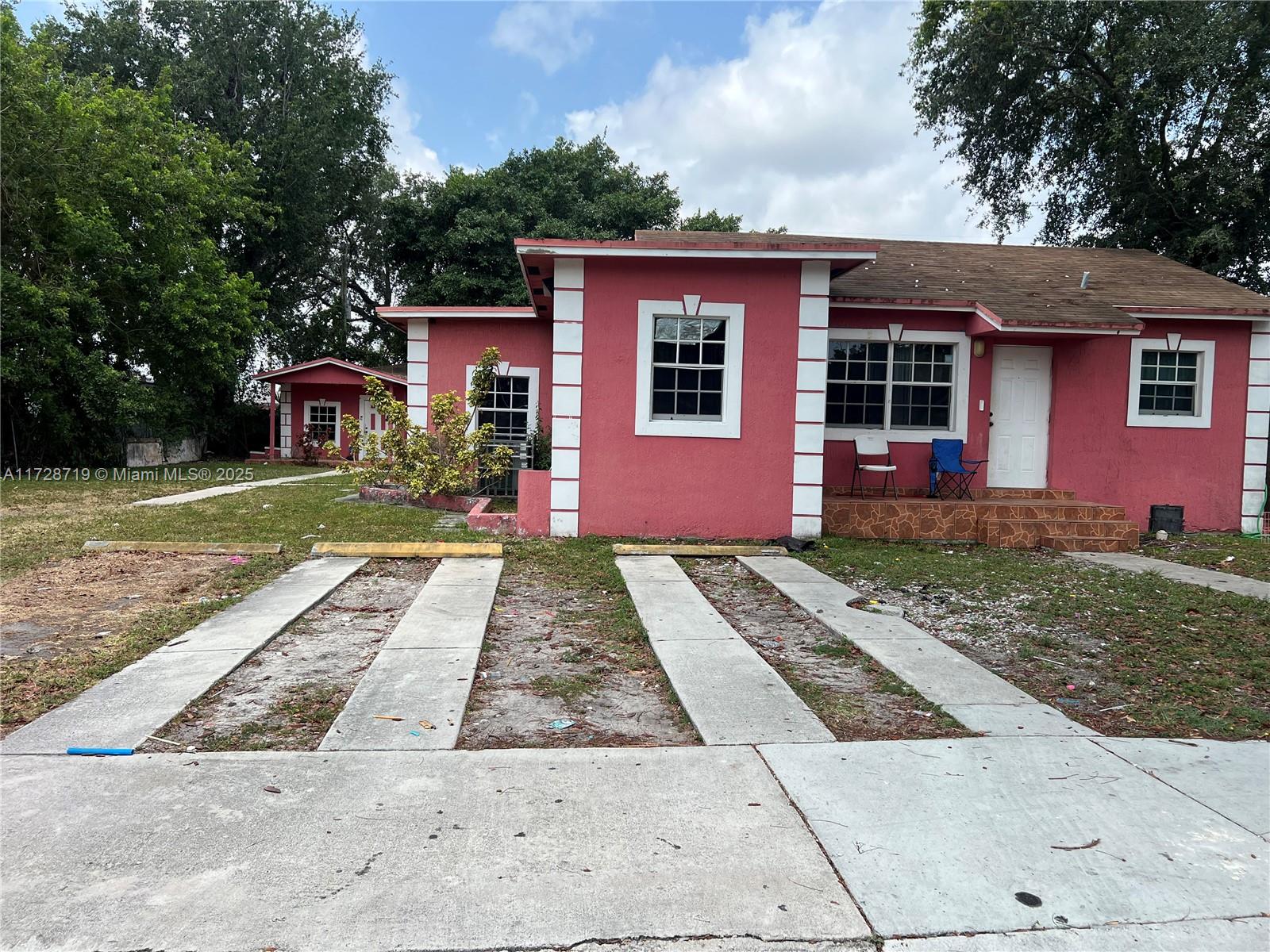 CALLING ALL INVESTORS.............. This is a very LARGE multi-family duplex dwelling. The front unit is 5 bedrooms 2 baths and the rear unit is 3 bedroom 2 bath (currently used as a 2/1 & 1/1) with separate electric and water meters. Great investment property.
