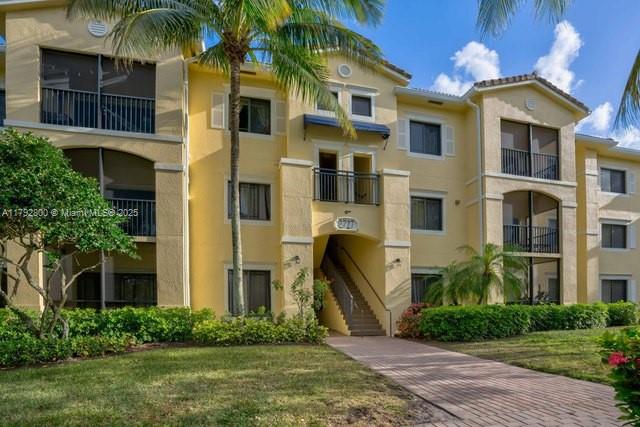 This beautifully maintained and tastefully furnished first-floor condo offers 3 spacious bedrooms, 2 bathrooms, and 1,395 square feet of comfortable living. The kitchen features stainless steel appliances with ample countertop space and cabinets, perfect for everyday cooking or entertaining. Enjoy the convenience of a full laundry room with washer and dryer. Freshly painted in white with wood laminate flooring throughout, the condo includes a generous master suite with a large walk-in closet and en-suite bath. Located in the gated community of San Matera, residents have access to tennis, pickleball, a clubhouse, gym, and a resort-style pool. Just minutes from The Gardens Mall, I-95, and Jupiter Beach.