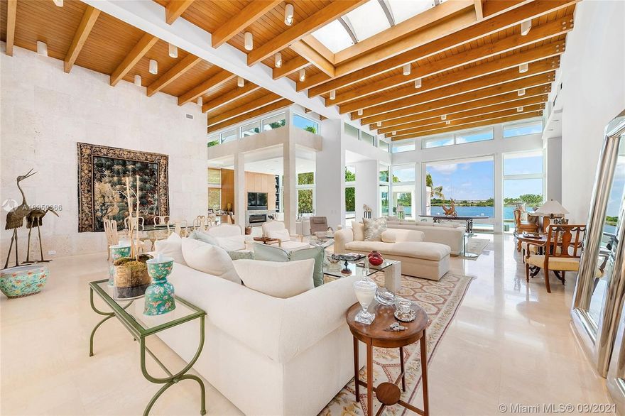 This contemporary bi-Level waterfront home sits on a 25,804 SF lot in guarded Sunset Island I. The 6BR/6+2BA split floor plan home features marble floors, amazing architectural design, custom walls & built-ins, soaring wood-beamed ceilings, skylights & large windows to enjoy true indoor/outdoor living. Amazing extended living room w/custom bar, open dining & family room w/fireplace all w/views to the pool & bay. Gym, office & temp/controlled wine room. Gourmet eat-in kitchen w/top-of-the-line Thermador & Sub-Zero appliances, butler’s pantry & separate breakfast area. The sumptuous principal suite features a seating area, voluminous dual walk-in closets & Carrara marble bathroom w/dual walk-in showers & spa tub. Large pool w/fountain, covered seating area, 97’WF, direct Bay & Ocean access.
