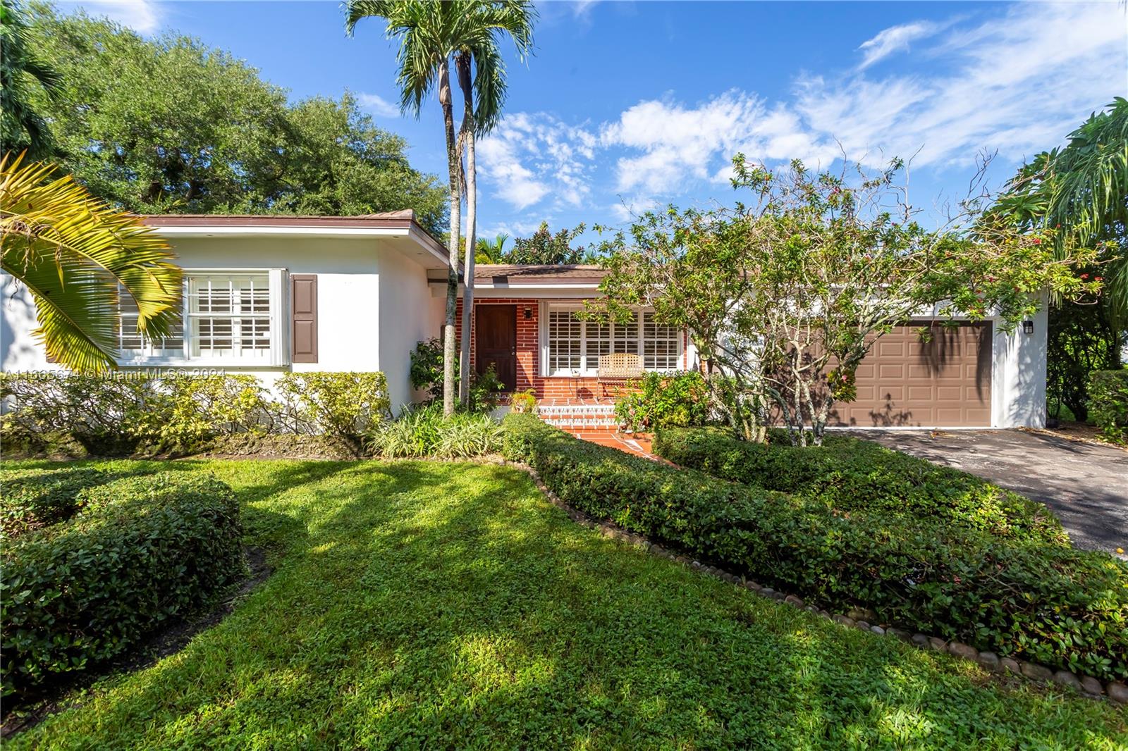 Fabulous 4 Bed / 2.5 Bath Coral Gables Home with large entertaining spaces on a 10,000 SF Lot! Upon entry, you feel the large open social areas including a stately living room and oversized family room that leads to the kitchen which has a wrap-around breakfast room & large dining room. The perfect home to entertain! The 4 bright bedrooms are on the same side of the home, featuring a gracious primary suite with 2 walk-in closets. Impeccable wood floors throughout the home. Large covered terrace outside encourages peaceful entertainment by your backyard. Convenient location close to Merrick Park, UM, Riviera Country Club, & more! Additional ftrs: Roof 2022, 2 Car Garage, Complete Accordion Shutters. Coral Gables Living!