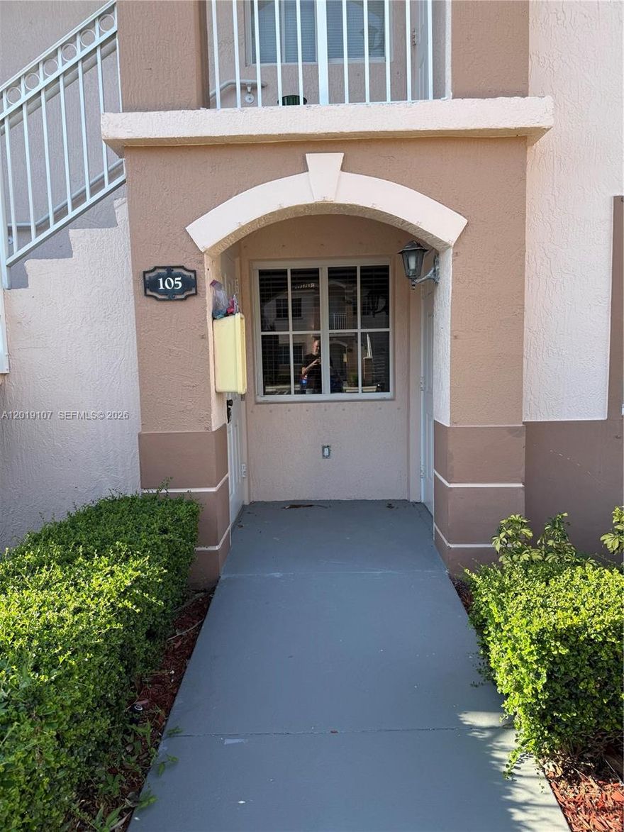First-floor 2 bedroom, 2 bathroom condo in gated Venetia Gardens with peaceful lake and green-area views. This 822 sq ft unit offers an open living/dining area, light-toned flooring in the main living space, tile flooring in the kitchen and bedrooms, two full bathrooms, and convenient ground-floor access. The kitchen features white cabinetry, refrigerator, range, microwave, dishwasher, and a pass-through opening to the living area. One bathroom has been updated with a walk-in shower and newer vanity finishes. Enjoy a quiet rear patio setting overlooking the lake and landscaped common areas. Excellent opportunity for an owner-occupant or investor looking for value in Homestead.