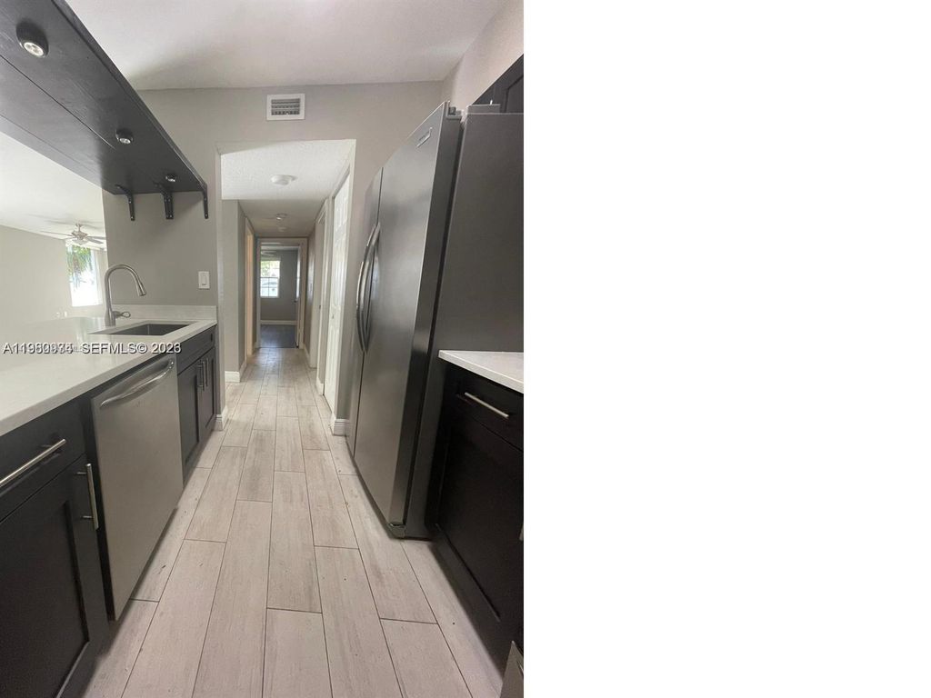 Photo of 2811 N Oakland Forest Dr #110, Oakland Park, FL 33309 (MLS # A11980934)