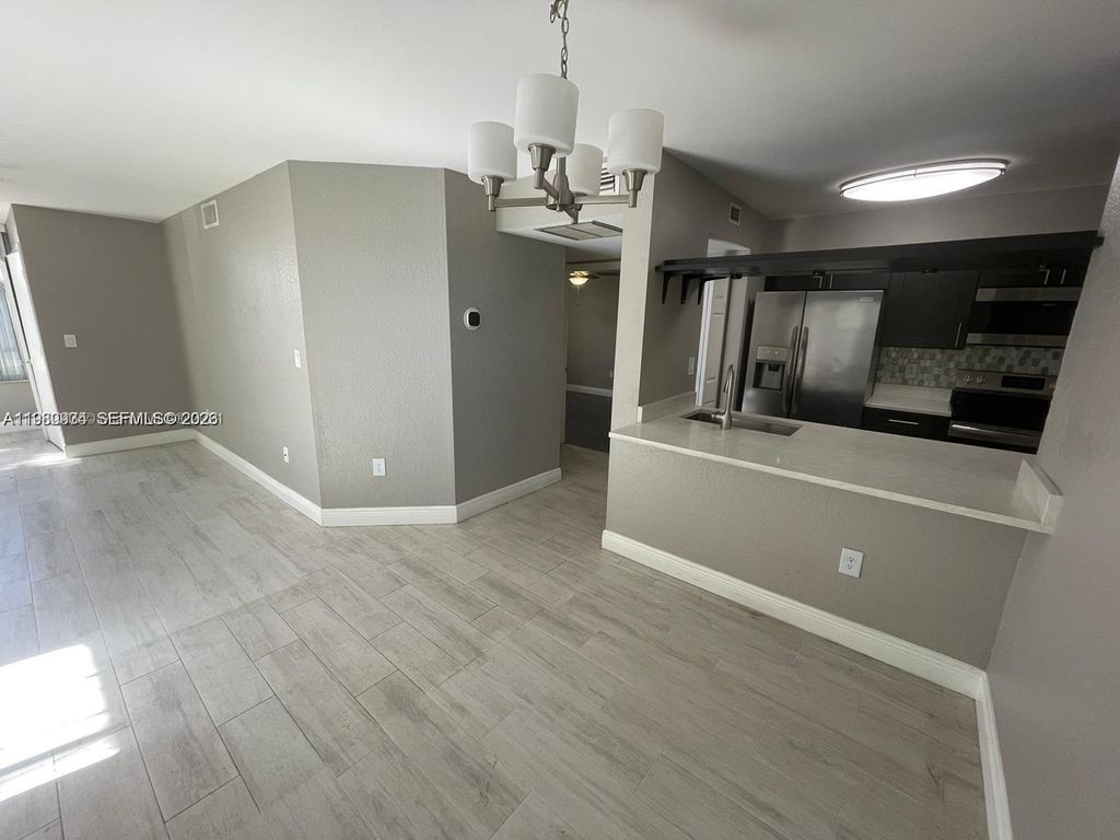 Photo of 2811 N Oakland Forest Dr #110, Oakland Park, FL 33309 (MLS # A11980934)