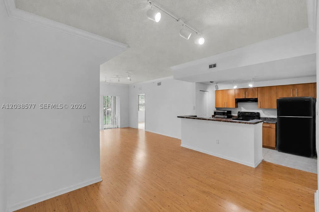 Photo of 5880 W Sample Rd #203, Coral Springs, FL 33067 (MLS # A12038577)