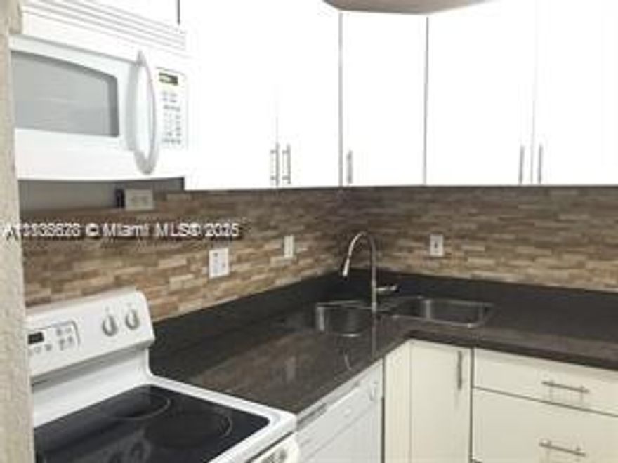 Charming Remodeled Kitchen, 2 bedroom & 2 bathroom, Shutters, Intercom and video cameras throughout the building. Walking distance to Walmart, LA Fitness. A few miles of Dolphin Mall, International Mall, Mall of Americas, FIU, Turnpike, 826, 836, Location, Location, Location!!!