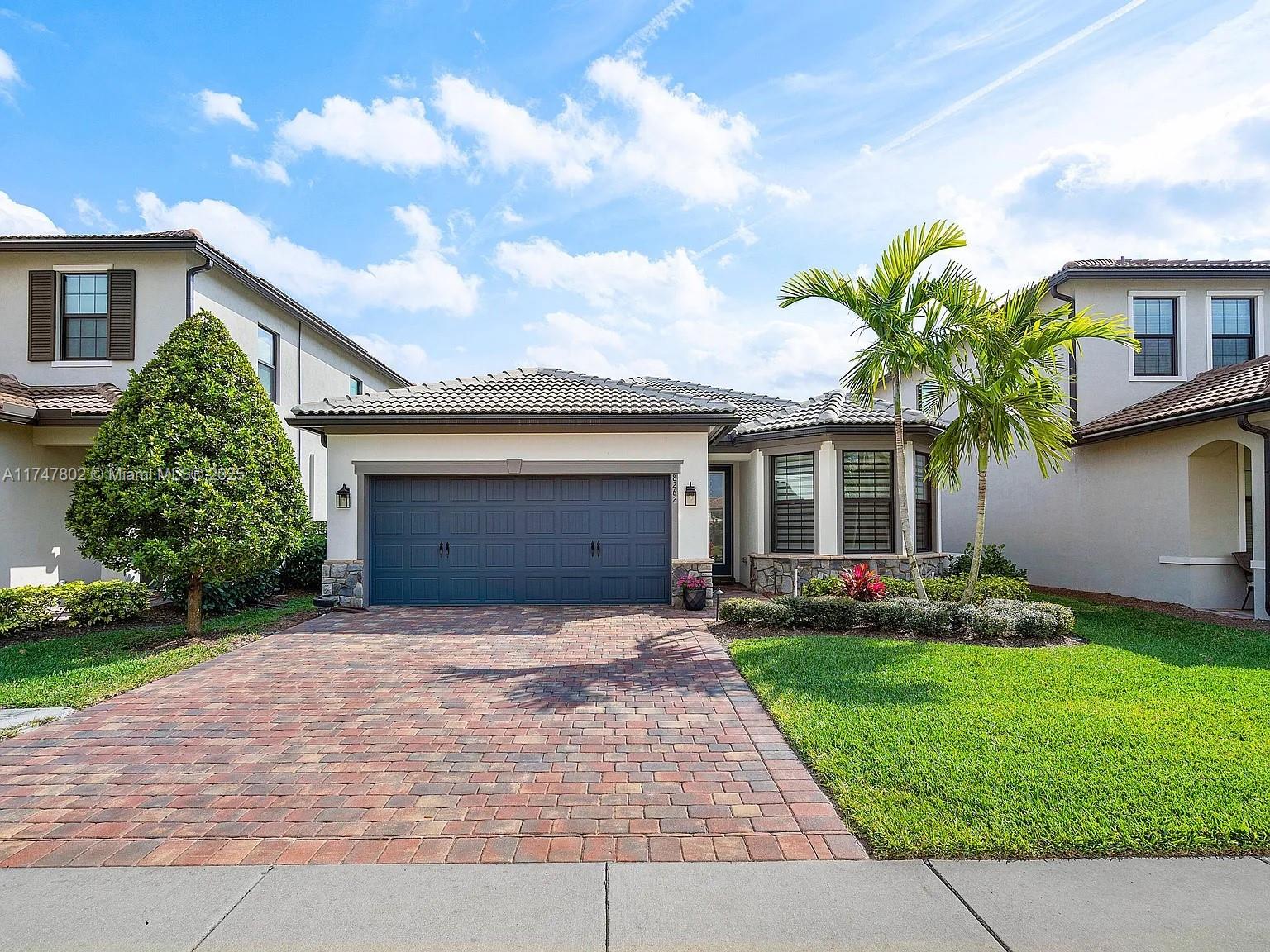 Exquisite 3/2. Elegant Gated Community living at its best. Open concept floor plan, vaulted ceilings and wood plank tile floors. Gourmet kitchen, stainless steel appliances, pantry, gas stove, large island, formal dining and living room. Large primary suite has breath taking views of the lake. Primary bath has dual sinks and large walk in shower. Two other bedrooms are located at the front of the house with a guest bathroom. Retractable sliders in family room that walk out to a Large screened in porch and steps out to a paved area to enjoy quiet evenings relaxing and looking over the lake. Walking distance to community gym and pool. Comes with Generac Generator and fully furnished.... Bring your clients best offers this property won't last...Property is truly a Gem...
