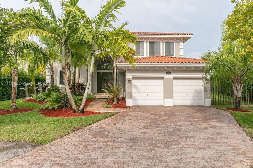 Spectacular contemporary 5/4 home marbles floors on an oversize, new bathroom, fenced, premium lot. Lush landscaping. Iron custom-made front door. Volume ceiling, SS appliances, kitchen open to a spacious family room and breakfast area. Master bedroom with balcony, walk-in closet, and his & hers bath area. The lease includes alarm, Internet, cable, lawn maint, and access to a spectacular Clubhouse with GYM, heated pool, tennis and basketball court, and kids' playground. Resort-style-living. Very easy to show.