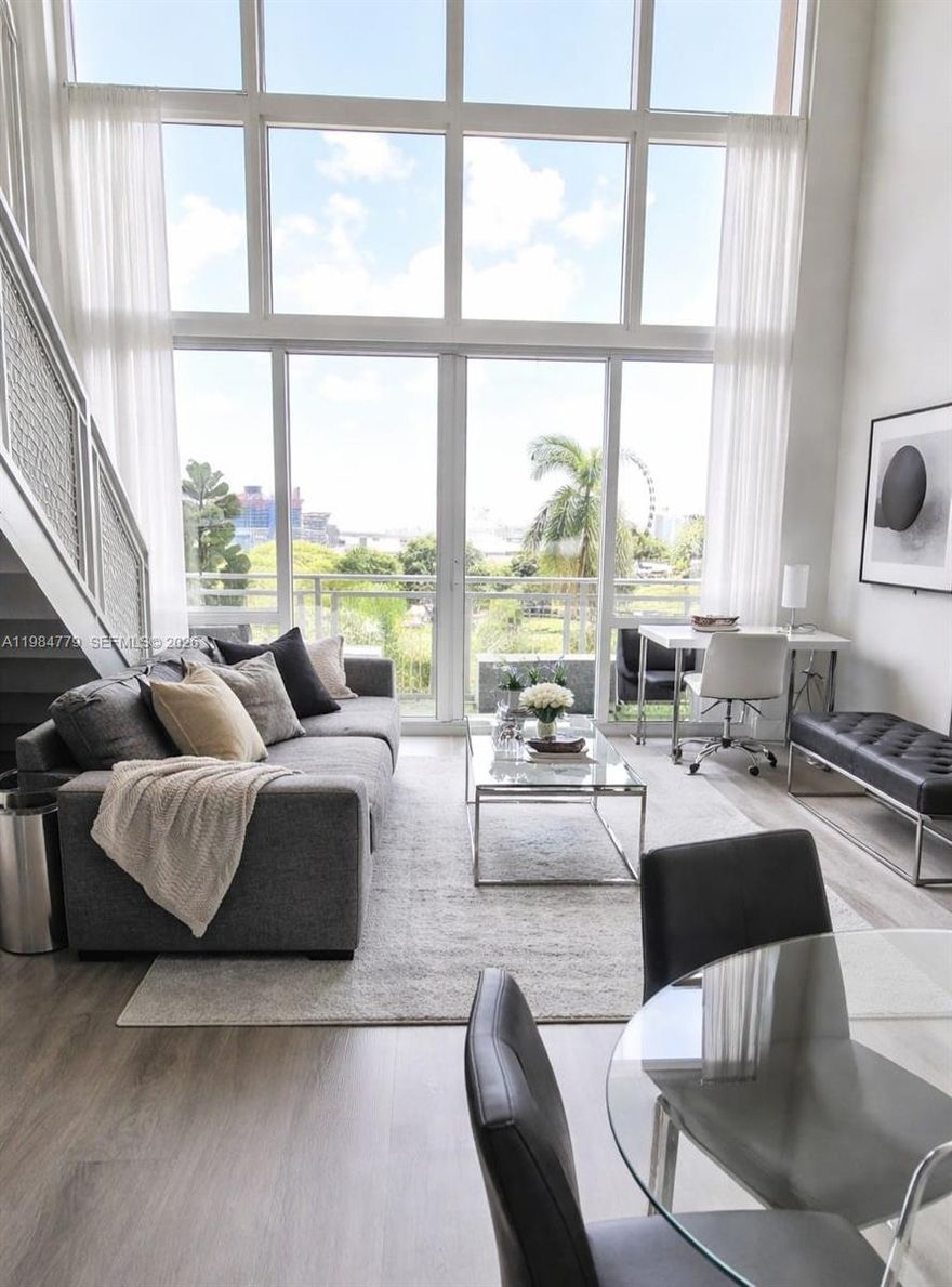 Experience the peak of Downtown Miami living in this breathtaking, fully furnished duplex that feels more like a private sanctuary than a traditional condo. The first thing you'll notice are the soaring 19-foot ceilings and massive walls of glass that frame the vibrant city energy and offer stunning views of the bay right from your private balcony. Every detail here screams luxury and convenience, from the sleek electric blinds to the rare advantage of having your assigned parking space on the same floor as your unit—no more waiting for elevators or hauling groceries through endless hallways.

Life at this building means you’re stepping into a true resort lifestyle. Whether you are relaxing by one of the three sparkling pools, hitting the state-of-the-art gym, or hosting a meeting in the elegant social rooms, everything you need is right at your fingertips. You are also just a short stroll away from Bayside, the Kaseya Center, and the absolute best dining the city has to offer. This is a unique opportunity to own a piece of the Miami skyline in a building where units here now benefit from streamlined management and a structure designed for those who want to be part of an elite hospitality program (30 days minimum / 12 times per year). Don’t wait to level up your lifestyle—this beauty is ready for its next owner and definitely won't last. Call me now to see it in person!