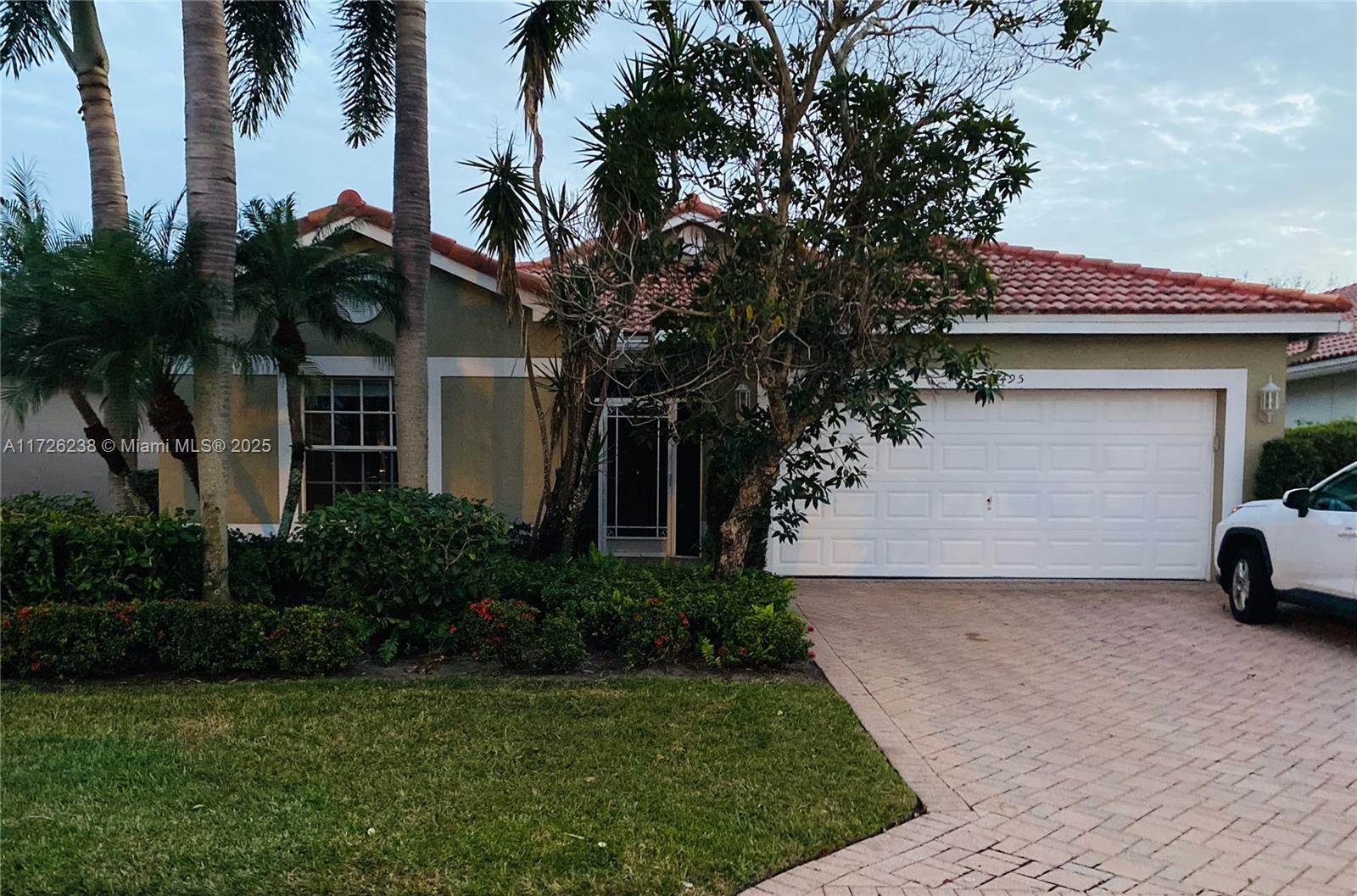 Your new home is ready & waiting for your personal touch! HUGE PRICE DROP! You'll have peace of mind living under the NEW ROOF installed in 2022! A/C 2022 & WATER HEATER 2023. Located in the 55+ boutique community of Grove Isle, this spacious home boasts vaulted 10' ceilings, 3 Bedrooms / 2 Full Baths & NO CARPET. Large tile on diagonal thru living areas with wood laminate floors in all bedrooms. Granite countertops in kitchen with plenty of storage. Enjoy the privacy & serenity of your large, screened patio & garden. Two car garage. Amenities include pool, tennis courts, dog park and clubhouse to enjoy social activities. One pet allowed. Not too far from the beach, you'll also appreciate the close proximity to shopping, restaurants, cultural centers, parks & trendy Delray Beach. Call Now!