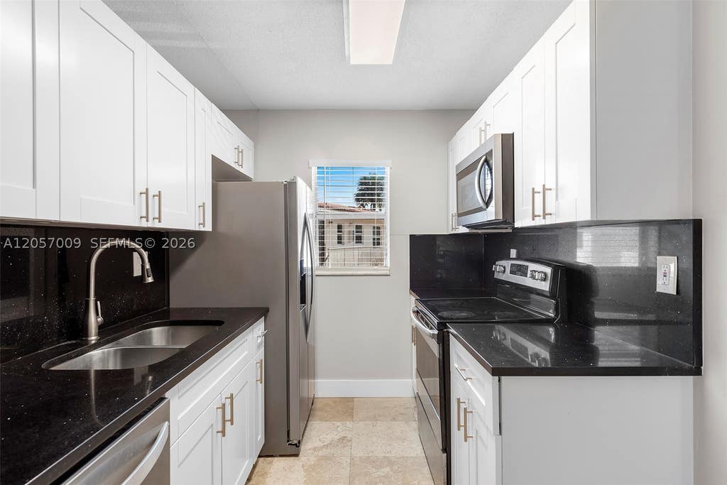 Photo of 3242 Coral Ridge Dr #3242, Coral Springs, FL 33065 (MLS # A12057009)