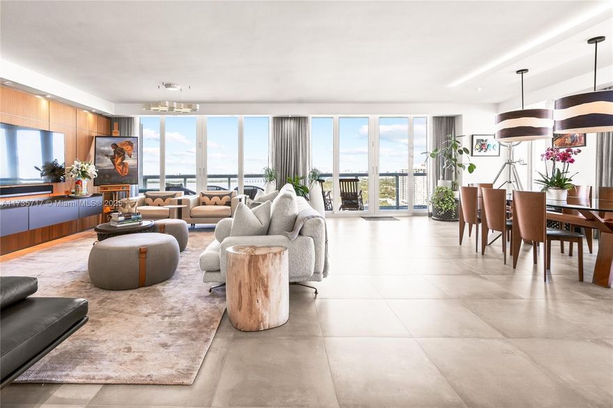 Wake up to breathtaking sunrises and unwind with stunning sunsets in this fully renovated Lower Penthouse at Belle Isle’s Grand Venetian. This rarely available, 3-bed, 3-bath residence spans the entire east side, offering 270° panoramic views—from South Beach’s turquoise ocean to Biscayne Bay and the iconic Miami skyline. Floor-to-ceiling hurricane-impact windows flood the space with natural light, complementing the sleek design. A Rimadesio media wall anchors the great room, while wraparound terraces provide seamless indoor-outdoor living. Enjoy 2 parking spots, resort-style amenities including a pool, gym, and tennis court. Walk just a few short steps to Sunset Harbour’s top wellness, dining & shopping spots. Don’t miss your chance to own this extraordinary piece of paradise!