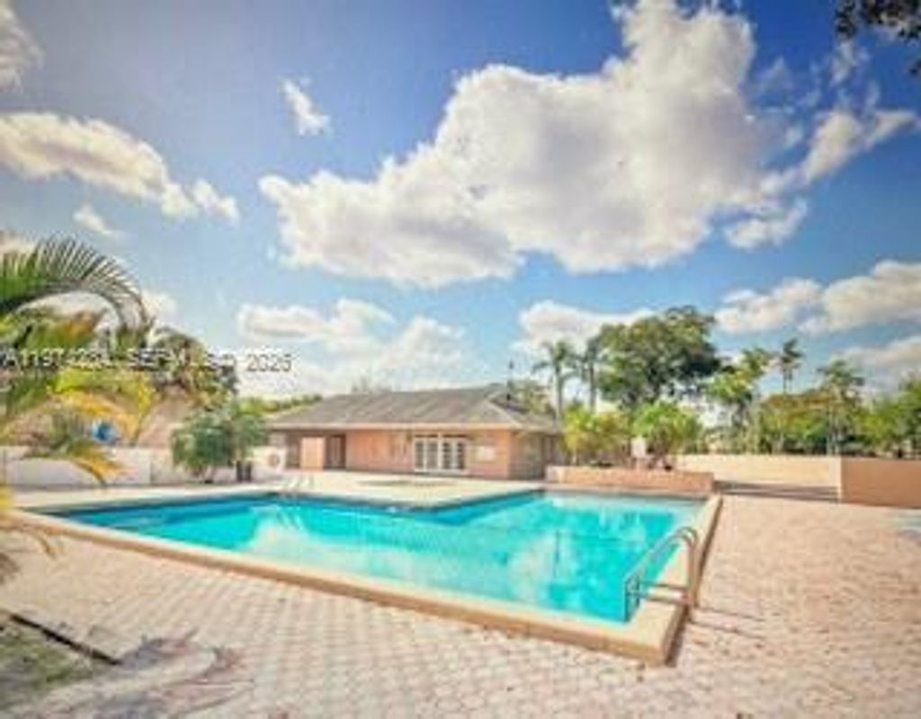 Photo of 1941 NW 96th Ter #8F, Pembroke Pines, FL 33024 (MLS # A11974284)