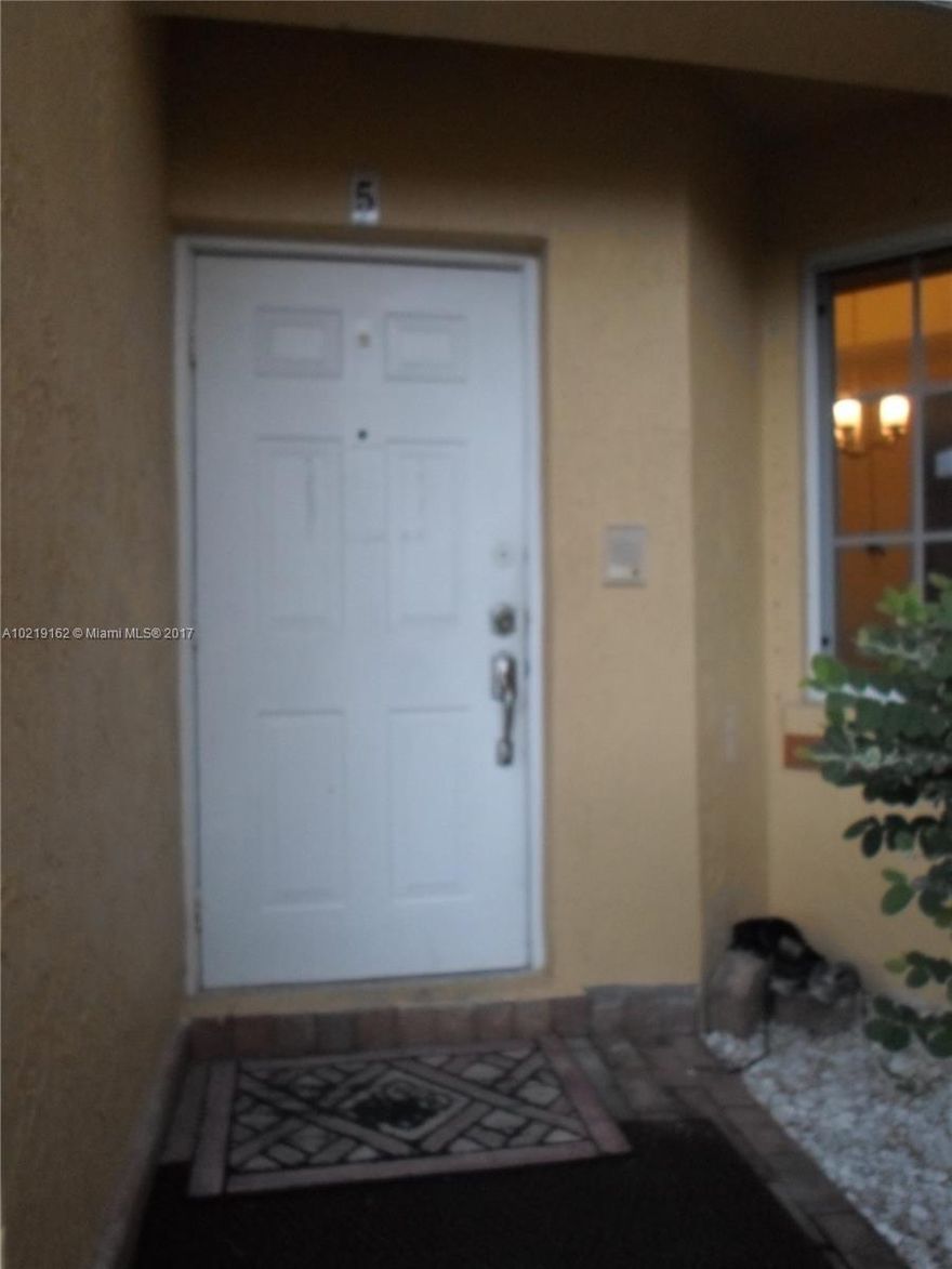 Spacious 3/2 condo located in desirable neighborhood and conveniently located near schools, shops and restaurants. Unit is in great condition, tile floor throughout with wood stairs. Brand new (Samsung) stainless steel kitchen appliances with newer energy efficient central A/C and full size washer/dryer. All bedrooms have large walk-in-closets.