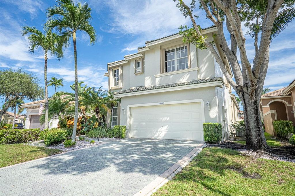 Photo of 12539 NW 58th Mnr, Coral Springs, FL 33076 (MLS # A11868640)