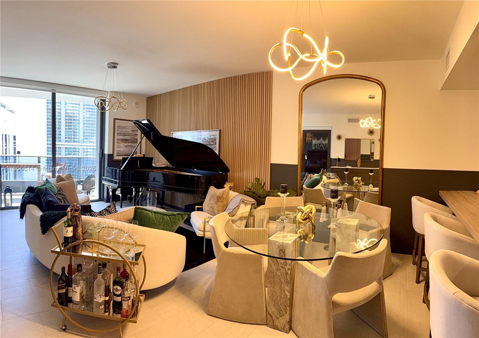 Experience elevated living in this impeccably designed 1-bedroom, 1.5-bath residence located in the iconic Brickell Flatiron 48th floor. This spacious unit features a generous terrace offering breathtaking cityscape and partial water views.
Every detail has been curated by a renowned interior designer, with high-end furnishings and fixtures. The Italian kitchen is equipped with premium Miele appliances and an integrated water filtration system.
Smart home features include a keyless entry system, and custom automatic black-out rollers in both the primary bedroom and living area.
Ideally located just steps from Mary Brickell Village and Brickell City Centre, you'll enjoy world-class shopping, dining, and entertainment at your doorstep. Could also be rented fully furnished.