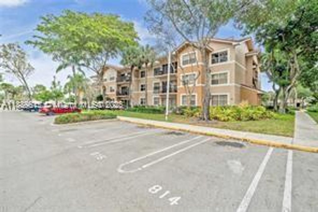 Photo of 8801 Wiles Rd #104, Coral Springs, FL 33067 (MLS # A11889615)