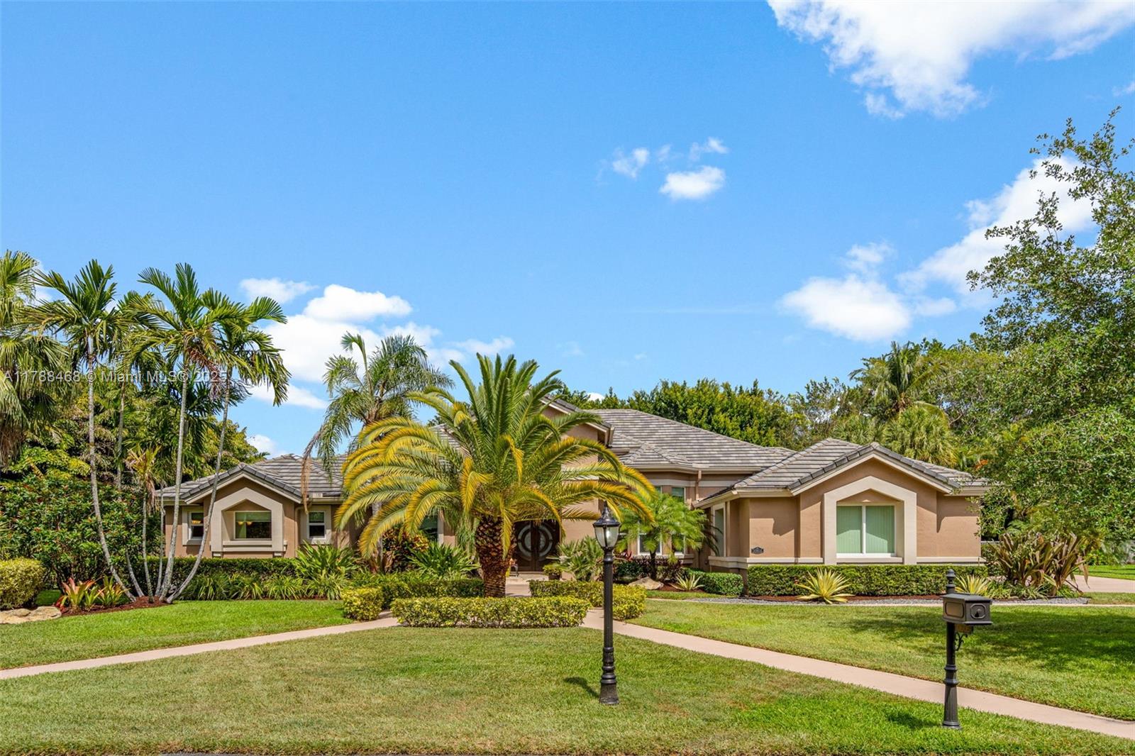 Elegant Family Living in a Gated Tropical Oasis. This 4 Bed + Den, 3.5 Bath home offers refined family living with space, comfort, and style. The 3 car garage has a converted extra room adding an additional 285 Sqft making the total under A/C approx 4,200 sqft. Enjoy high ceilings, expansive living areas, a dedicated home office, and sunlit bedrooms with tranquil garden and pool views. A gourmet remodeled kitchen & new bathrooms add modern convenience, while serene bedrooms provide restful private spaces. Step into your private backyard paradise with a sparkling pool and outdoor living room —perfect for entertaining. Hurricane Impact Windows & Doors 2019. Close to Top Cooper City schools, parks, and upscale shopping, this is luxury living made for family life. Easy to Show!