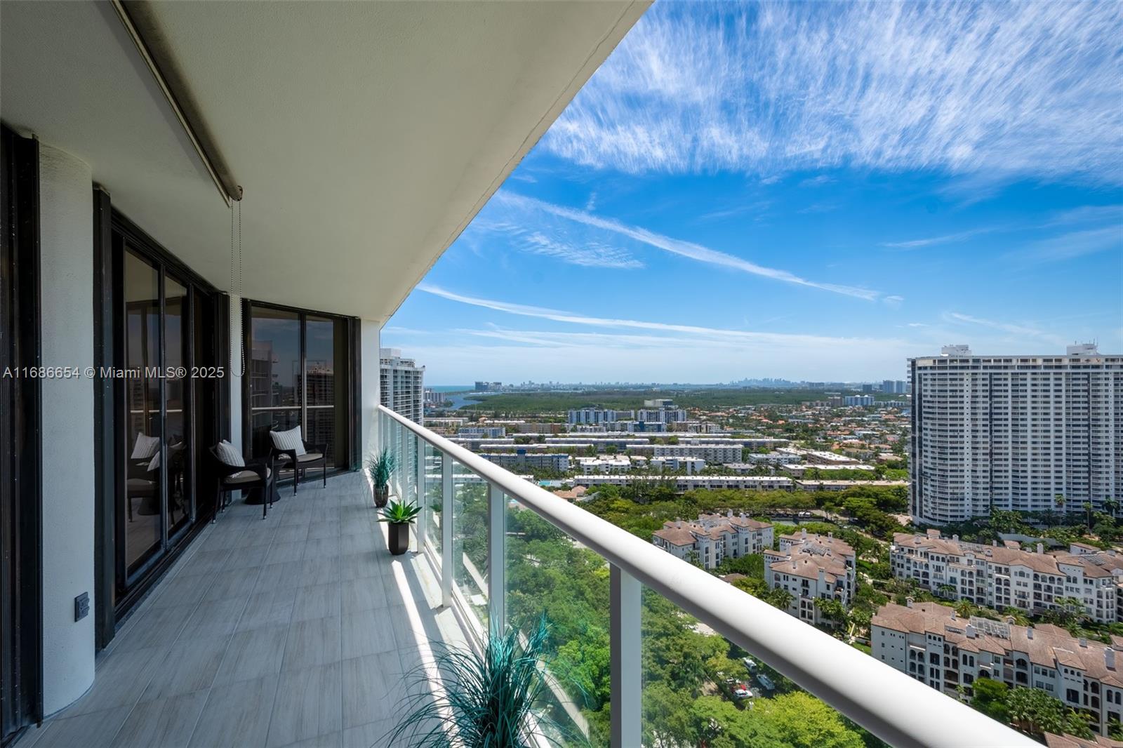 Welcome to Williams Island 4000 Tower in Aventura. This stunning 1,508-square-foot, 2bd/2ba condo on the 29th floor offers a blend of elegance and comfort, with sweeping views of the bay and ocean that extend south to the sparkling shores of Miami Beach. Step inside to discover a thoughtfully designed split-floor plan, featuring newly installed plank tile flooring in both bedrooms, sleek smooth ceilings, smart home controls, and electric Levolor shades throughout for effortless ambiance control. The updated kitchen shines with new top-of-the-line LG Signature Series appliances, including a refrigerator & dishwasher. The spacious primary has breathtaking vistas & direct access to your private terrace.