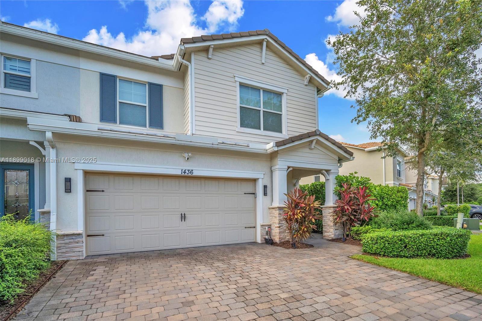 Rarely available corner lot townhome! Stunning 3BR/2.5BA home with 2-car garage on an oversized lot and beautiful lake views. Enjoy outdoor living with a screened covered porch and open patio- Perfect for entertaining. Inside, this spacious home features upgraded tile and carpet flooring, 8’ doors, and an open-concept layout with a modern kitchen showcasing an island, quartz countertops, and plenty natural light throughout the family and dining rooms. Additional highlights include impact windows & doors and smart-home readiness with Vivint security system. Resort-style amenities include a clubhouse, pool, fitness center, tennis courts, and a 70-acre park with scenic bike & walking trails. Prime location with easy access to Turnpike, I-95, beautiful beaches, and top dining!