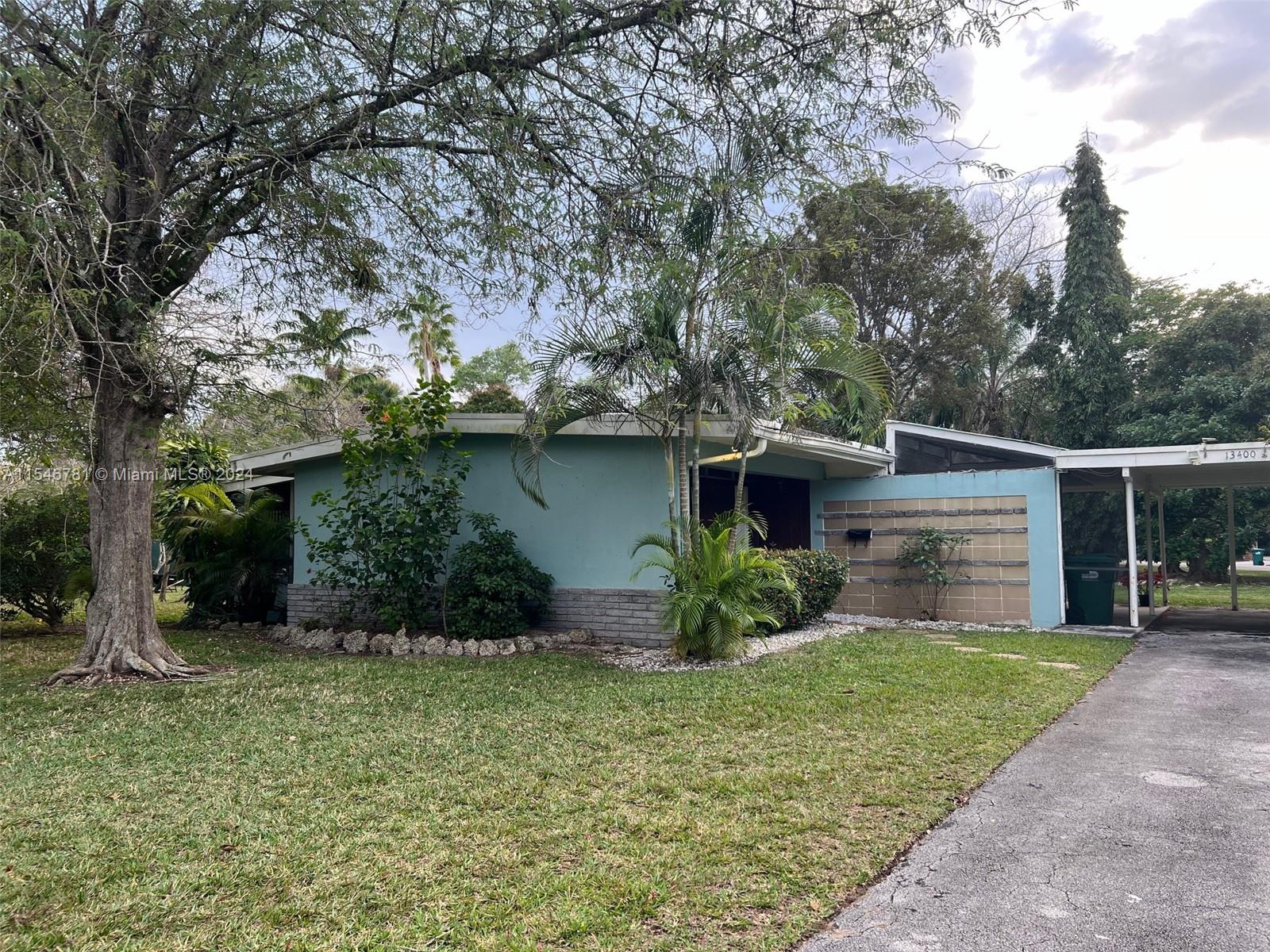 Come and enjoy the exotic trees in your own park-like setting. You'll love the serenity of this cozy Pinecrest home situated on a quiet Builder's almost Acre , The kitchen features tastefully wooden cabinets and granite countertops, with large neutral tiles freshly laid on the diagonal throughout the home. You'll also delight in the spacious patio garden which is great for Miami.The house has an extra space, This property has no association fees and is conveniently located near good schools such as Howard Drive Elementary, Palmetto Middle, and Miami Palmetto Senior High.