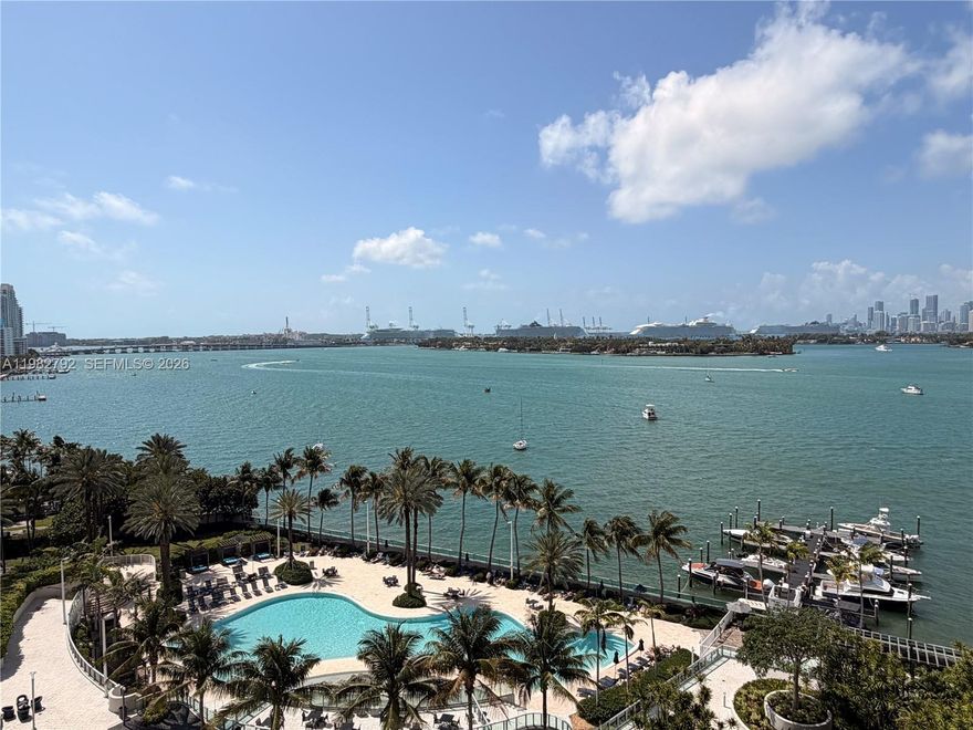 Located on the 11th floor, this modern, fully renovated apartment offers abundant natural light and spectacular sunsets over Biscayne Bay, with stunning views of Fisher Island and Brickell Skyline, as well as the complex's pool and tropical gardens. The unit features a spacious, modern kitchen with quartz countertops, stainless steel appliances and elegant finishes, as do the bathrooms. It also boasts motorized blackout and solar blinds in the rooms and living room. Its modern design creates a sophisticated and confortable ambiance, ideal for enjoying the exclusive South Beach lifestyle with impressive waterfront views.