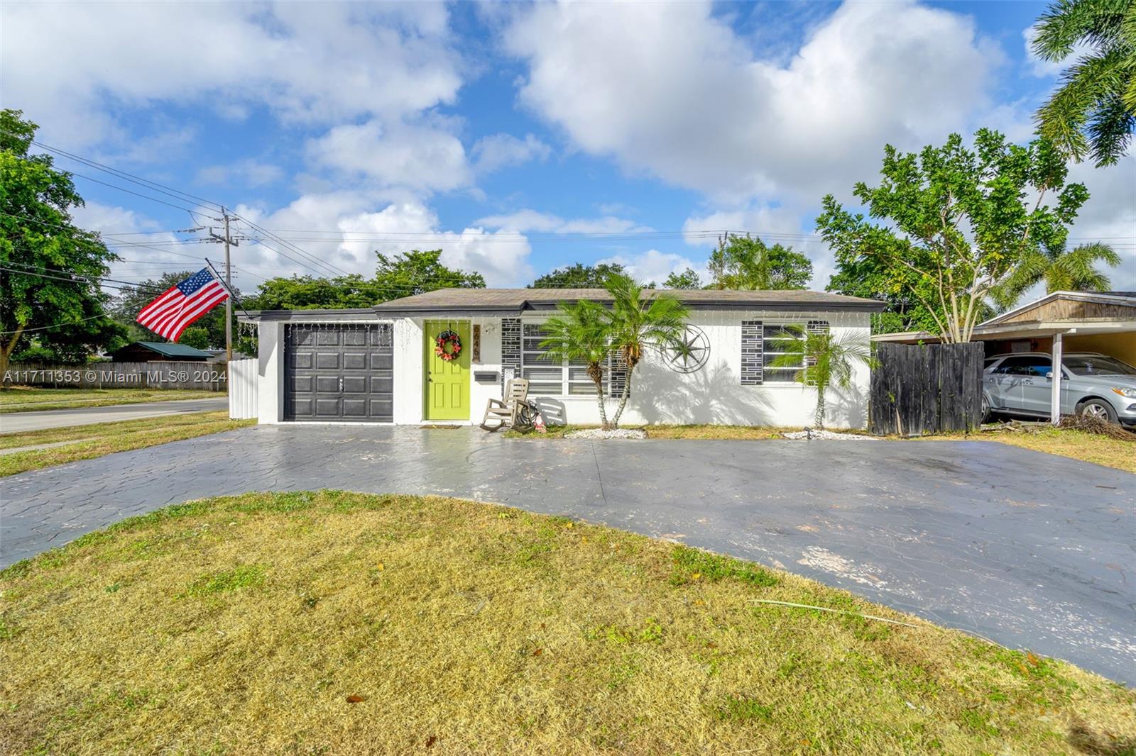 Situated on a spacious corner lot in a quiet neighborhood, this charming 3-bedroom, 1-bathroom home offers an open, bright layout with ample living space and natural light. The home boast a well-equipped semi-open concept kitchen, a spacious family room but standout feature is the large 4-car detached garage—spanning 720 square feet and with its own separe entrance—perfect for storage, vehicles, a Boat, a workshop or it can be converted for additional living space or office space. Conveniently located near major roads, shopping, dining, and just a short drive to Hollywood Beach, this home combines comfort and potential. Schedule a showing today!