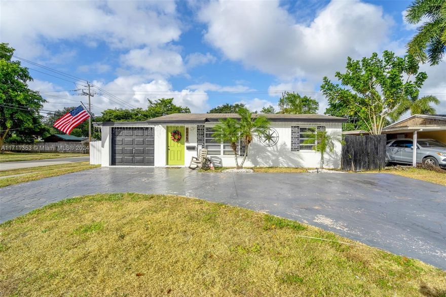 Situated on a spacious corner lot in a quiet neighborhood, this charming 3-bedroom, 1-bathroom home offers an open, bright layout with ample living space and natural light.  The home boast a well-equipped semi-open concept kitchen, a spacious family room but standout feature is the large 4-car detached garage—spanning 720 square feet and with its own separe entrance—perfect for storage, vehicles, a Boat, a workshop or it can be converted for additional living space or office space. Conveniently located near major roads, shopping, dining, and just a short drive to Hollywood Beach, this home combines comfort and potential. Schedule a showing today!