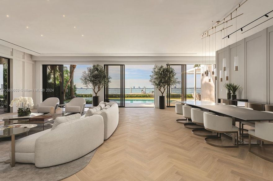 Enjoy refined luxury at this extraordinary N Bay Rd residence w/ stunning western views. Fully renovated w/ 2023 completion. Meticulous design & exquisite materials converge to create a haven of unparalleled elegance. A warm & inviting ambiance is achieved through a mocha cream limestone color palette, elegant slab finishes, & herringbone flooring that exudes classic sophistication. 8,540 SF of living spaces include an incredible layout, 6 bedrooms, media room + office, high ceilings on both floors, a butler kitchen, large primary suite w/ dual bathrooms & dual oversized closets. A brand new concrete dock, gated privacy, an outdoor oasis overlooking sparkling sunsets, a poolside summer kitchen overlooking the waterfront vistas add to the allure of this coveted N Bay Rd address.