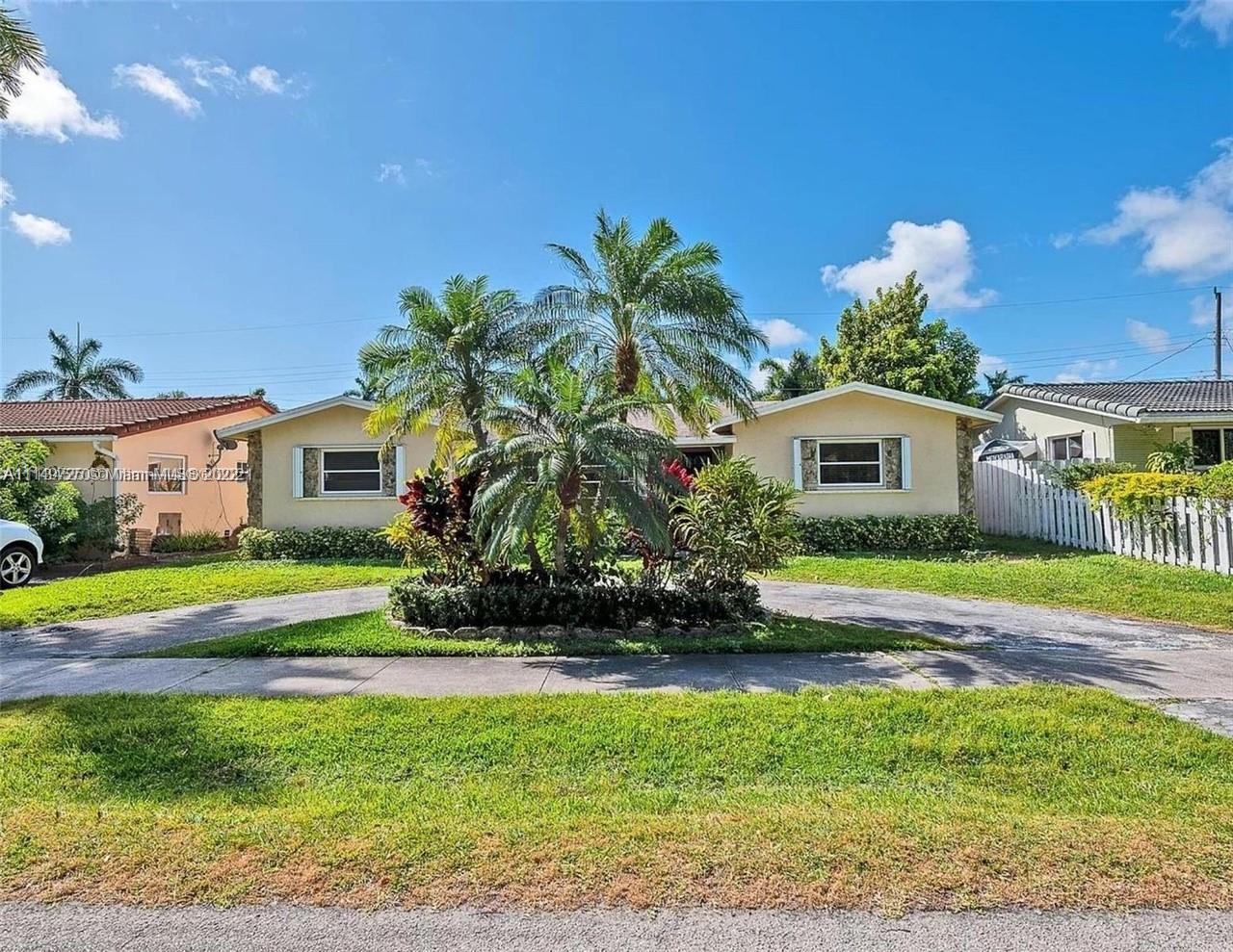 Your dream home awaits in the beautiful Hollywood Lakes neighborhood, walking distance from Hollywood Beach Boardwalk. This 4 bed 2 bath home has been renovated and updated. It features a split layout with large porcelain floors, oversized updated quartz countertops throughout with gorgeous white cabinets providing plenty of storage for the cook in you. The large master bedroom has 2 closets and a huge modern master bathroom that is sure to please. The other 3 bedrooms are stacked yet split from the master and Florida room that is open to the kitchen and dining. Wait until you see the large laundry room with extra storage, it will blow you away. Enjoy the screened-in patio that is nicely placed inside of a completely fenced yard. 5 min from the beach.