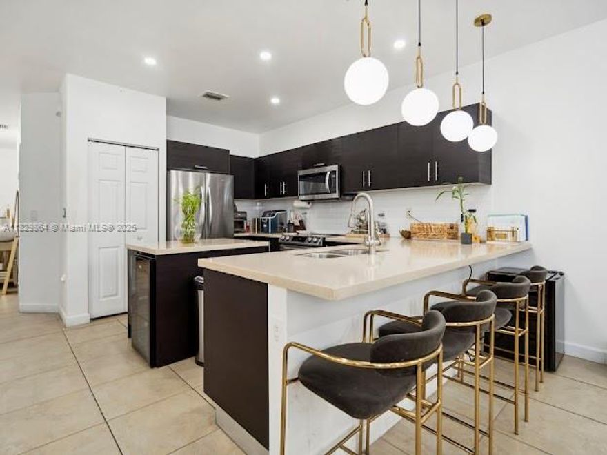 Beautiful and remodeled 2 story home 5 Bedrooms / 4 Bathrooms in prestigious gated community Vintage Place in Doral. 1 Bed /1 full Bath on 1st floor and 4 Beds /3 full Baths on 2nd floor. Alkaline water system through entire house. Excellent distribution with modern open concept kitchen, quartz countertops, ceramic floor all throughout 1st floor and wood floor on 2nd floor, stainless steel appliances, wine cooler, impact windows, blinds, beautiful & large backyard w/ a florida room. 1 car garage and driveway for 3 cars. Rental payment includes cable, alarm, high-speed internet/fiber optics and Clubhouse with amenities: pool, gym, sauna, game room, playground, and BBQ area overlooking the lake. Excellent and quiet community. Near shopping centers, highways and excellent schools.