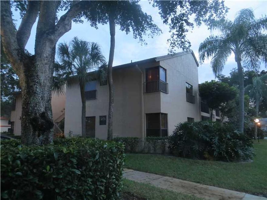 Price decrease for fast sale, run, do not walk! Centrally located 3/2 unit in beautiful Karanda Village. Karanda is part of Township master association which holds several amenities, such as clubhouse services, health and wellness programs and outdoor activities. This unit has an excellent layout with  split bedroom plan & a screen porch patio with a full size washer and dryer. Tile throughout and carpeted bedrooms.Complex is close to Turnpike, Sawgrass Expressway and I-95 & within a great school zone.