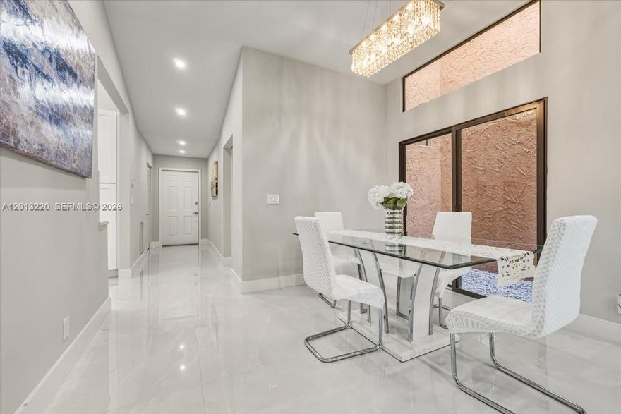 Exquisitely renovated 2-bedroom, 2-bath villa nestled within an exclusive gated community, showcasing breathtaking water views. This sophisticated residence features premium Italian porcelain flooring throughout, a designer kitchen, and elegantly upgraded bathrooms. Thoughtfully enhanced with a brand-new 2025 A/C system and water heater, the home offers both style and peace of mind. Enjoy tranquil waterfront living in a refined setting, with the added benefit of HOA coverage including roof maintenance, cable, and internet for effortless, turnkey comfort