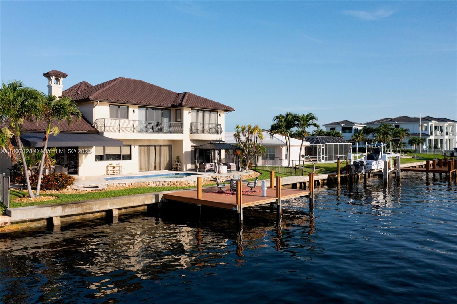 Welcome to the epitome of luxury! This home has it all: An enviable LOCATION. Situated on an 8,000 SF lot w/ 80 ft along the deep & wide Intracoastal, you'll relish watching majestic ships cruise by. Just a ten-minute drive to the beach & Country Club. Step inside this TURNKEY home & be amazed: The professional chef's kitchen is a culinary dream, complemented by 2 master bedrooms (1 on the first floor), high ceilings & large windows that bathe the interior in natural light. The pool overlooking the Intracoastal beckons you to relax amidst lush landscaping & outdoor lighting. Built-in 2006 & thoughtfully remodeled, the house exudes elegance with custom drapery treatments, automatic blinds, superior entertainment system & new kitchen appliances. Fully equipped (w/ short-term rental license).