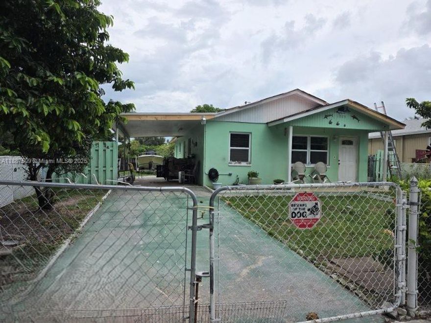 Attention Investors!! Brand New 2025 metal roof. Hurricane Impact windows and doors will be installed by 10/16/2025.  Newer water heater, AC 2019, and updated bathroom.  Tile flooring throughout home.  Nice corner lot in a well-maintained neighborhood. Property is located next to a park, and close to stores, Palm Beach Zoo and Aquarium.  Home has been well kept by the same owner for the last 14-years.